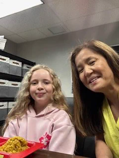 Girl and a woman in the office. 