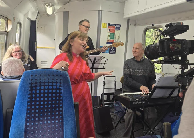 The Revd Kate Bottley and The Dave Clegg Duo filming on The Forget-Me-Not Train