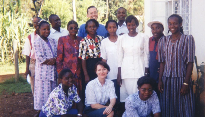 Ted Miguel (back, center), now a UC Berkeley professor of economics, stands with part of the team from the NGO International Child Support.
