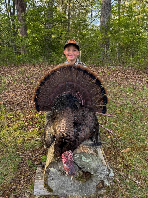 A hunter with a turkey.
