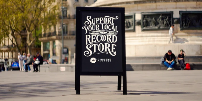 A sign. 
Support your Local Record Store. Worldwide.
Place de la République, Paris. 