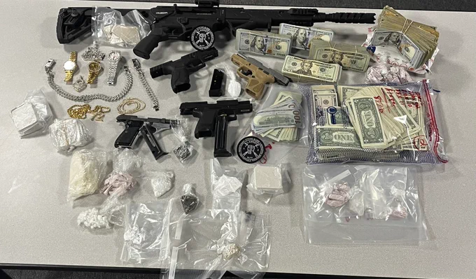 Picture of narcotics, cash and weapons seized during the execution of numerous search warrants this morning by LAWNET.