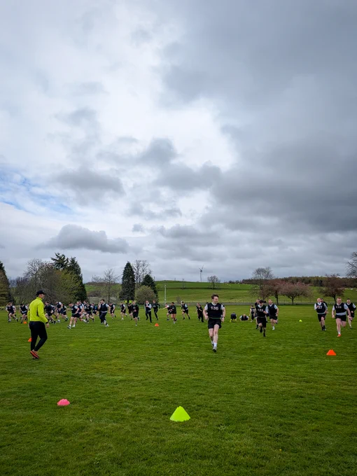 Police officers running on the playing fields at the Scottish Police College, Tulliallan.