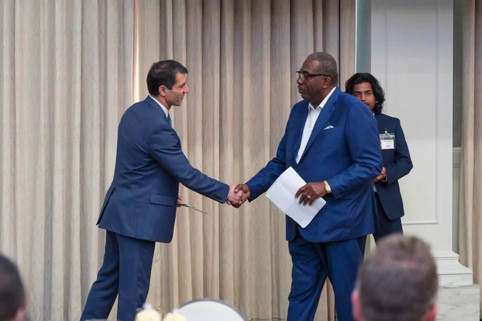 Dean Jalili shakes hands with Senator Royce West