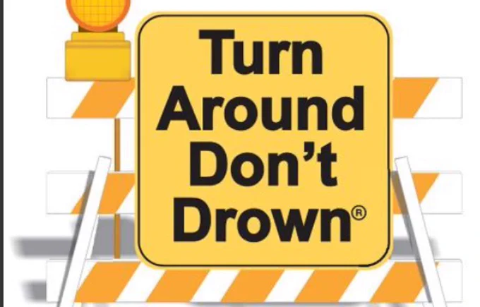 Sign saying turn around don’t drown.