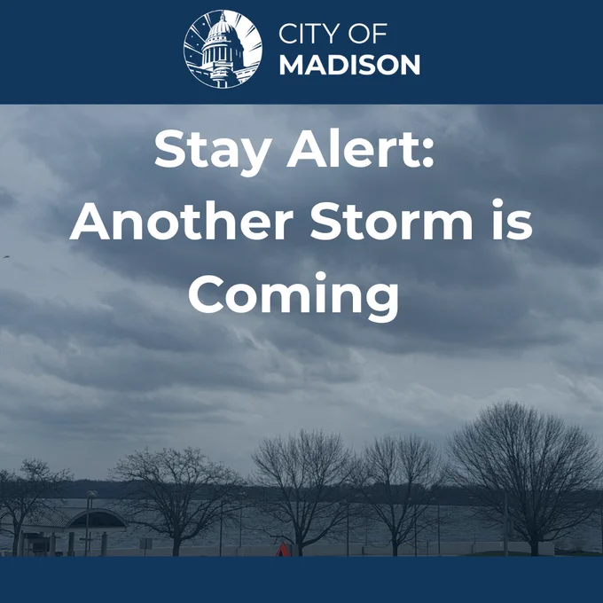 Text reading "Stay Alter: Another Storm is Coming" in front of a sky full of dark clouds.