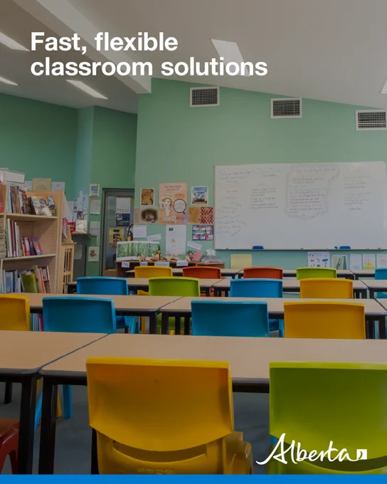 Empty classroom with rows of tables and colourful chairs facing a whiteboard and bookshelves; text reads ‘Fast, flexible classroom solutions’ with the Alberta logo