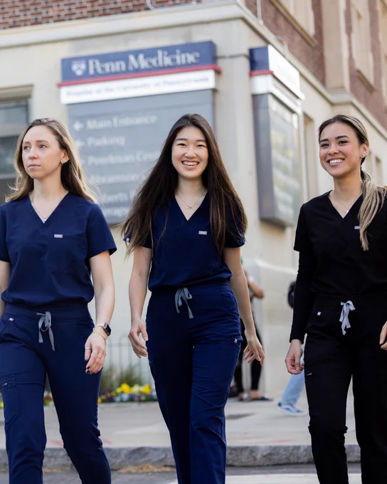 Pre-Health students walking across the street. 
