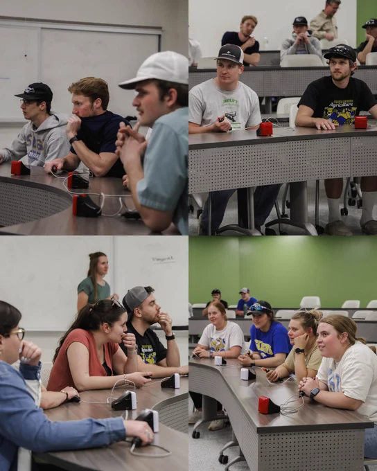 Participants sit at classroom tables using buzzers during Ag Week trivia at SDSU, listening and preparing to respond to questions.