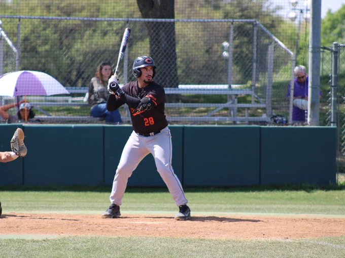 Dallas College Cedar Valley baseball player Julio Cuotto holds his bat up, awaiting a pitch. Cuotto drove in two runs in the Suns' win at No. 6 Dallas College North Lake Friday. 