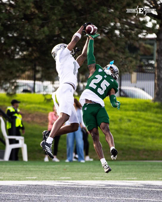 Antonio Floyd and Rayquan Adkins jumping up for a ball