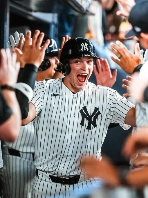 Ben Rice celebrates in the dugout after hitting a home run. 