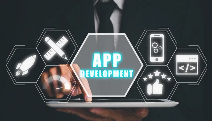Image of a person interacting with a tablet displaying icons related to app development, including a rocket, mobile phone, code, thumbs up, and other tech-related symbols, symbolizing the process of app creation and innovation.