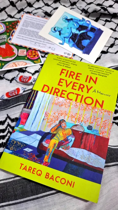 A photo of a book titled Fire in Every Direction: a Memoir by Tareq Baconi. The book cover is yellow and depicts a colorful painting of a man sitting on a sofa with his hand on his head. The wall behind him is covered by floral wallpaper. His body looks like it is covered by splatters of colorful paint.