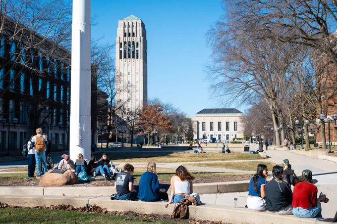 Students study in the Diag near Ingalls Mall on a warm spring day.