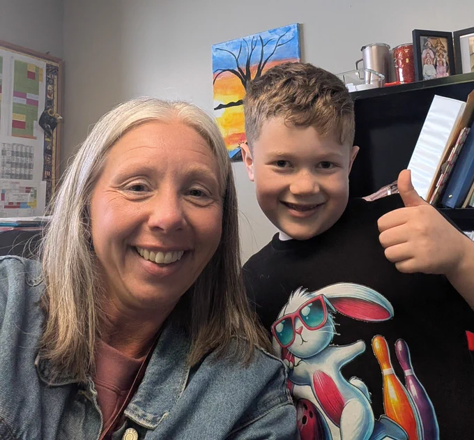 Assistant Principal with student 