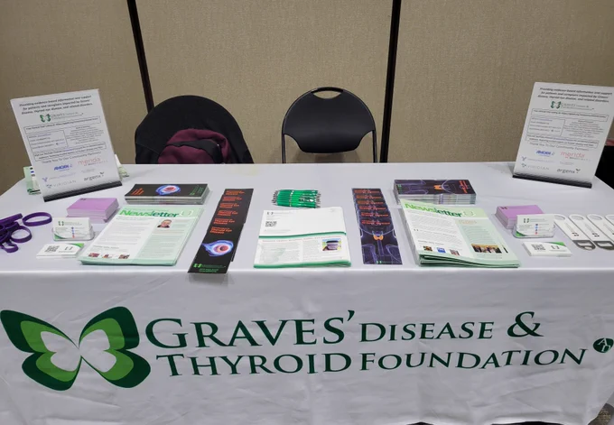 Tabletop space with Graves' Disease & Thyroid Foundation logo and newsletters/brochures