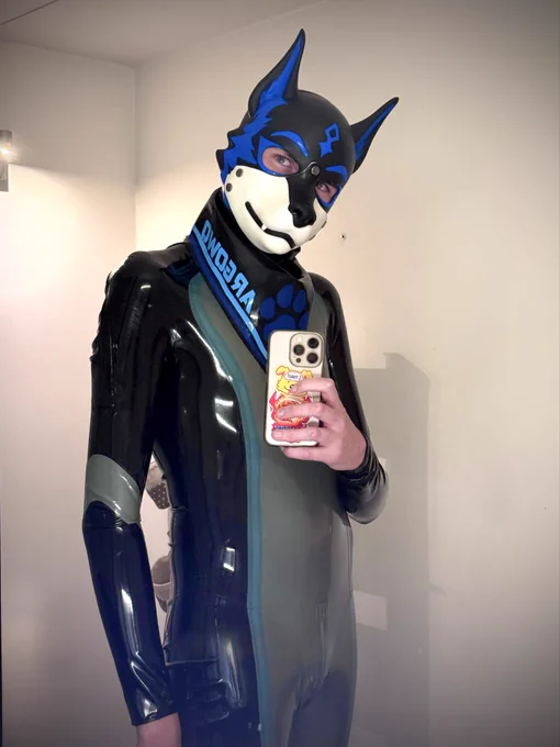 A blue shiny pup taking a selfie in the mirror, he looks enticing