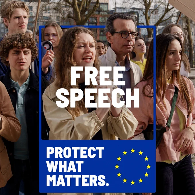 The image shows a group of people, mostly young adults, gathered outdoors. Overlaid on the image is a blue sign with the words 'FREE SPEECH' in large white letters and 'PROTECT WHAT MATTERS' in smaller white letters below it. The sign also features a circle of yellow stars representing the EU flag.
