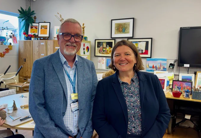 Ellie smiling with Herefordshire Headway CEO Steve Heptinstall