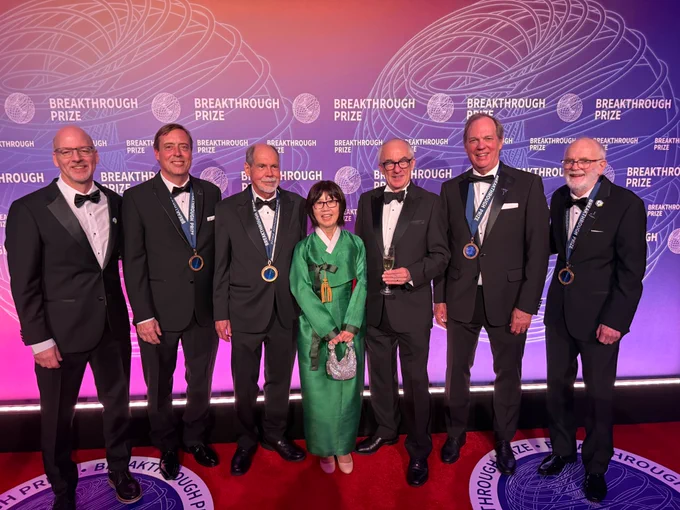 At the Breakthrough Prize ceremony on April 18, 2026, left to right: Brookhaven National Laboratory Interim Director John Hill, Fermi National Accelerator Laboratory (Fermilab) physicist Chris Polly, Boston University physicist Lee Roberts, Fermilab Director Emeritus Young-Kee Kim, CERN Director General Mark Thompson, University of Washington physicist David Hertzog, and Brookhaven Lab physicist William Morse. (Courtesy of Kat Morse)