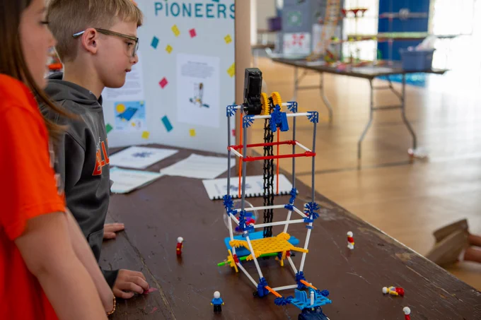 Photo of students and their KNEX creation.