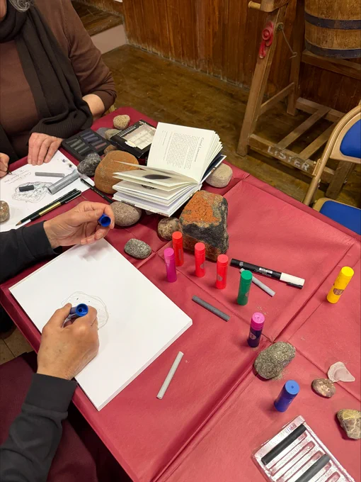 Stone drawing session in progress.