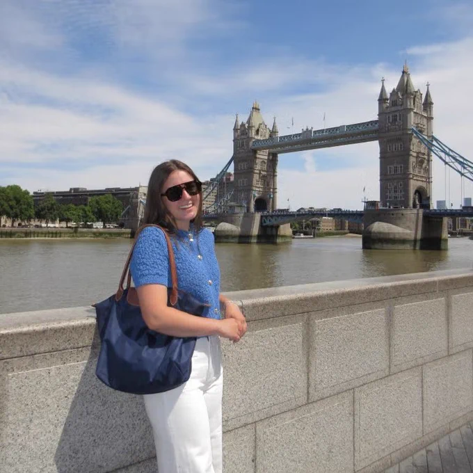 Sarah in front of the Tower Bridge in London. 