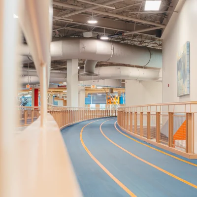 A winding blue and orange indoor Rec track on an upper floor.