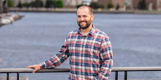 UWM grad Brennan Dow helps lead Milwaukee-area river restoration, coordinating agencies and funding to remove decades-old pollution.