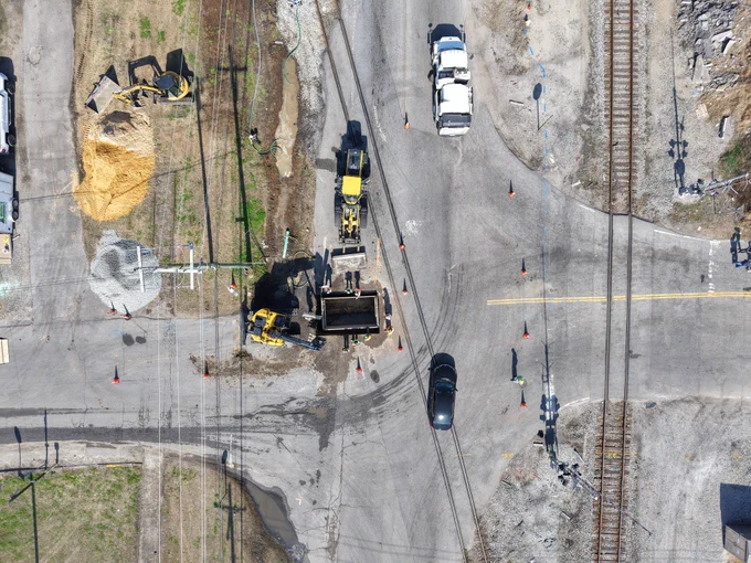 Aerial of a work zone with traffic passing nearby
