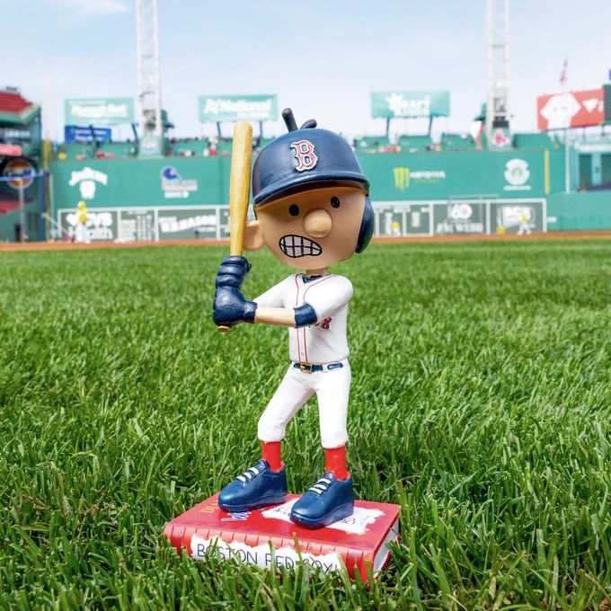 A Greg Heffley bobblehead the Red Sox gave away is pictured on the field at Fenway Park.