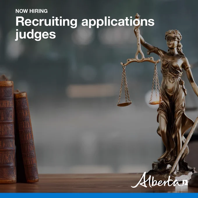The graphic image shows a table with old law books on the left and lady Liberty holding scales and a sword on the right. Overlaid text reads: ‘Now Hiring. Recruiting application judges.’ The Government of Alberta logo is in the bottom right. 