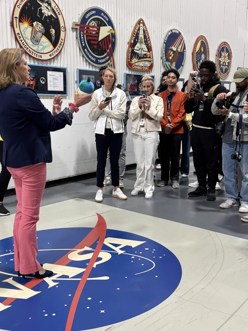 NASA’s Lori Glaze holds a replica of the Rise plushie that served as the Zero Gravity Indicator on the Artemis 2 mission while speaking to the NASA Social group at NASA Michoud.