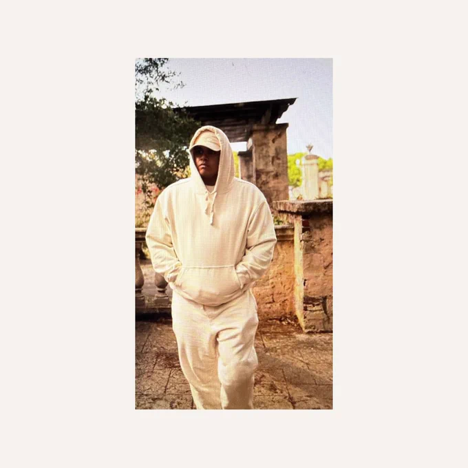 A picture of the founder of Highframe, Cesar Lazarus, wearing the HOODIE and SWEATPANTS in a snippet photoshoot for the clothing brand Forever Vision, coming in 2026.