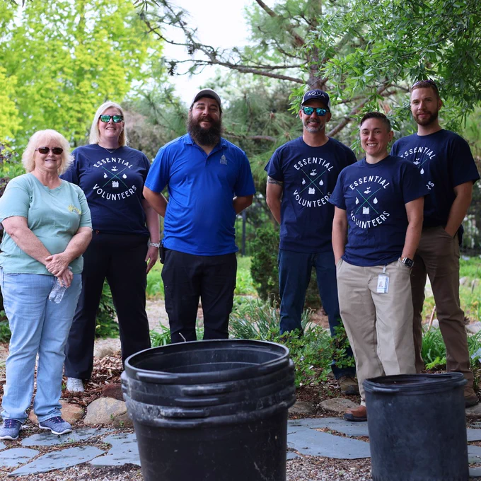 Aqua North Carolina team volunteering at Cape Fear Botanical Gardens, with the image above showing the team taking a group photo before volunteering.