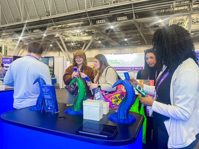 Attendees at Immunology 2026 test out the Squid Full Range Pipette (1 - 1000 µL)