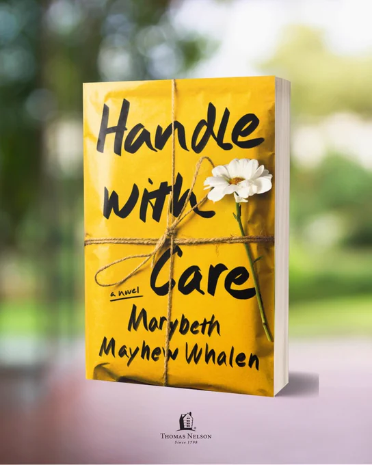 A yellow book cover is shown, featuring the title "Handle with Care" and author "Marybeth Mayhew Whalen." A white flower is tucked under twine wrapped around the book. The publisher, Thomas Nelson, is noted at the bottom. The background is softly blurred greenery.