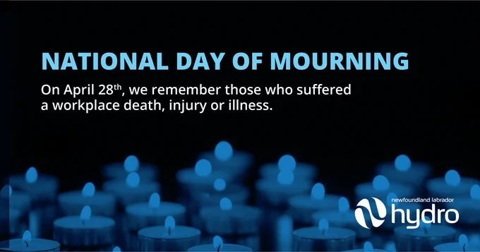 Image features a dark background with lit candles in soft focus. The text reads "NATIONAL DAY OF MOURNING" followed by the date "On April 28th, we remember those who suffered a workplace death, injury or illness." The logo of Hydro is displayed at the bottom right.
