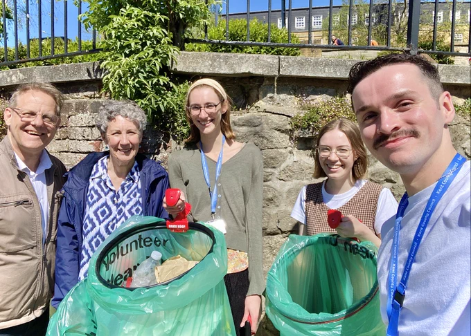 Shown here is a photograph of (from left) Mike, Lindsay, Victoria, Caitlin and James from the Kent Libraries and Archives teams, collecting litter along the towpath leading to the Archbishop's Palace, Maidstone.