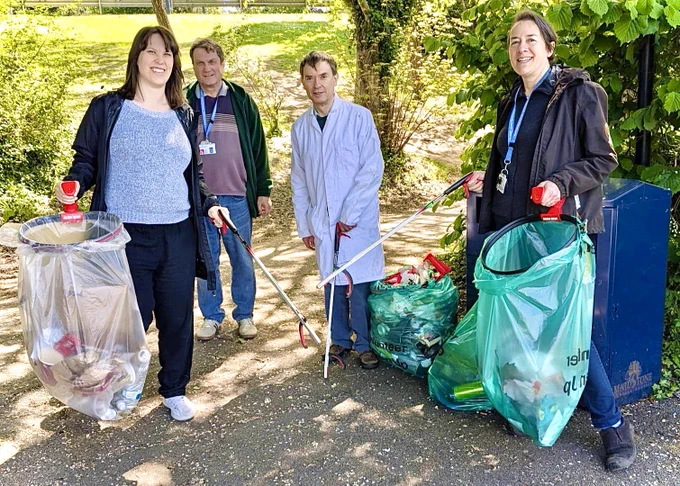 Shown here is a photograph of (from left) Hannah, Gareth, Mark and Lara from the Kent Archives team, collecting litter in the tree-covered area between James Whatman Way and Fairmeadow, Maidstone.