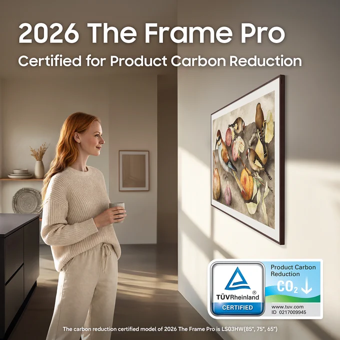 A woman admires a piece of art displayed on Samsung Frame Pro TV. The image shows '2026 The Frame Pro Certified for Product Carbon Reduction' text in the top left corner, while simultaneously featuring the Product Carbon Reduction certification from TÜV Rheinland.