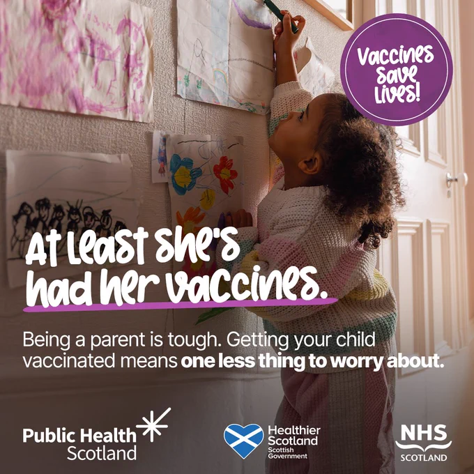 Young child drawing on wall art in a cozy home, highlighting the importance of vaccinations for peace of mind.