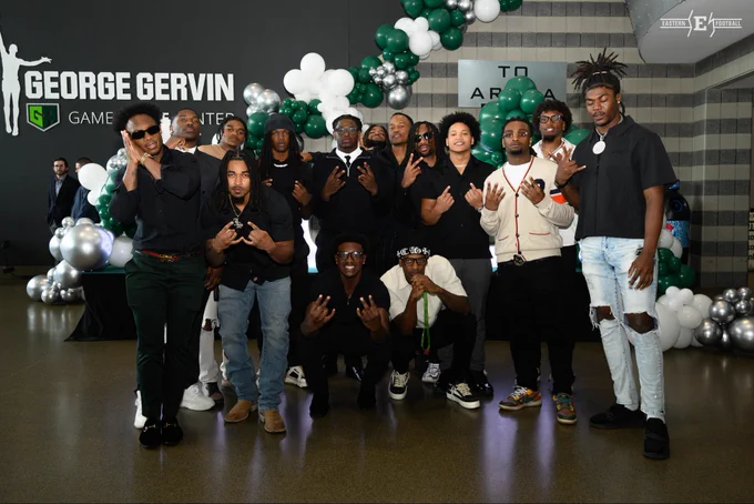 Football team players posing for a photo at the 2026 Ypsi’s