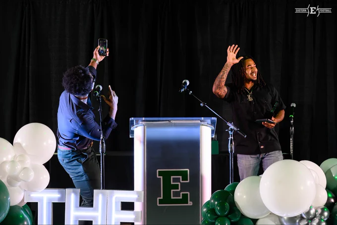 Bryce Llewellyn and Juan Salas present an award at the 2026 Ypsi’s