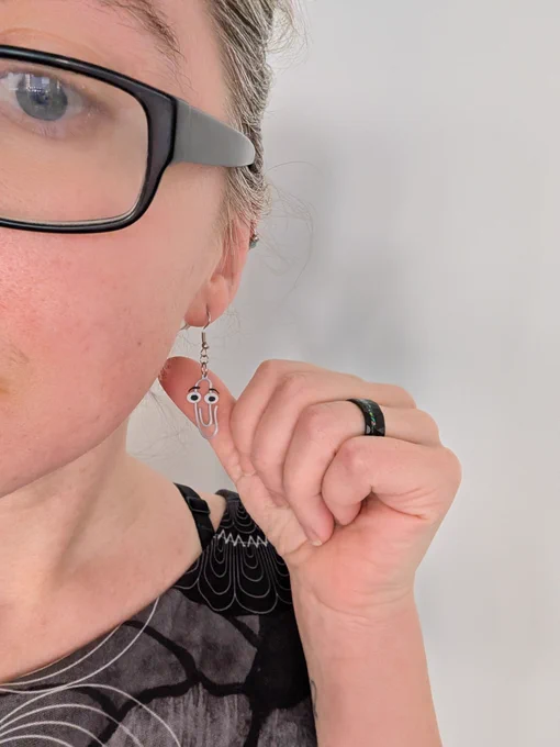 A close up of me wearing Clippy earrings 