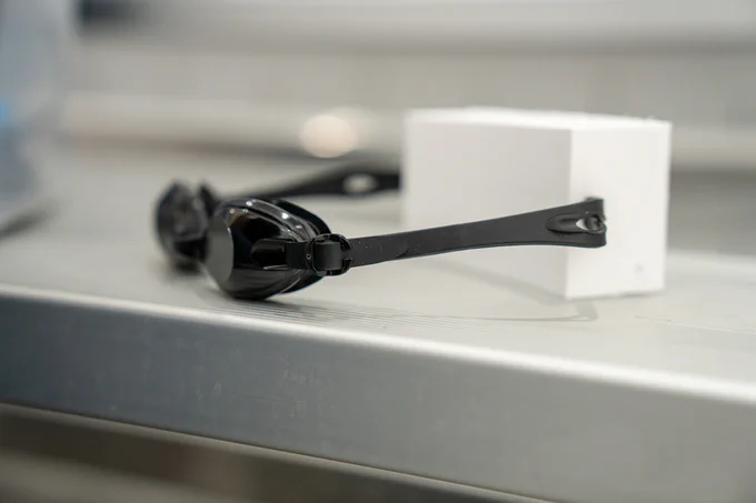 Smart goggles sit on a surface.