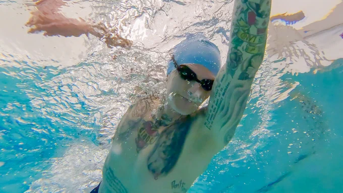 Steven Nape swims underwater wearing smart goggles.
