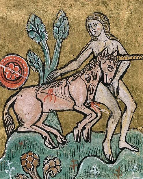 Medieval art of a woman comforting a wounded unicorn in her lap.