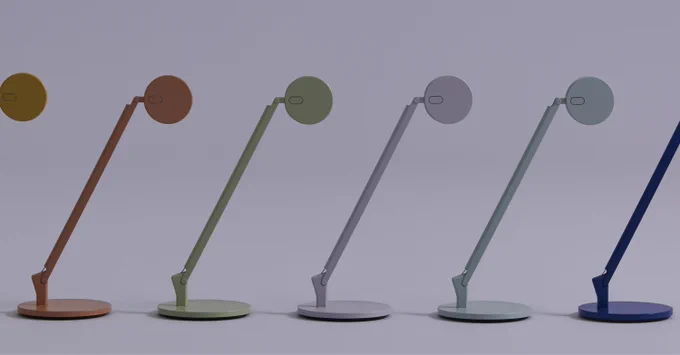 Row of five modern dash lamps in varying muted colors against a plain background.